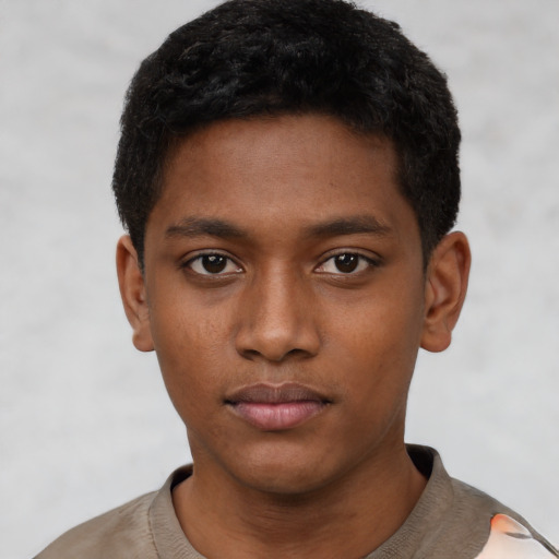 Neutral black young-adult male with short  black hair and brown eyes