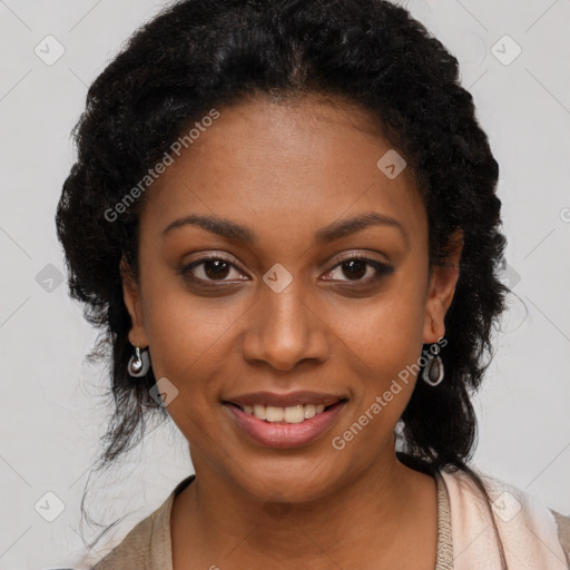 Joyful black young-adult female with long  black hair and brown eyes