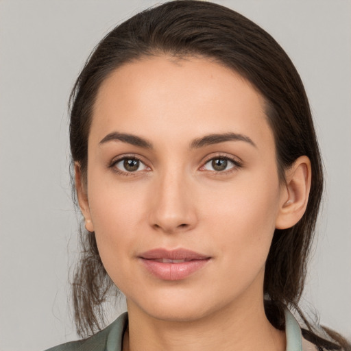 Neutral white young-adult female with long  brown hair and brown eyes