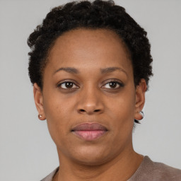 Neutral black young-adult female with short  brown hair and brown eyes