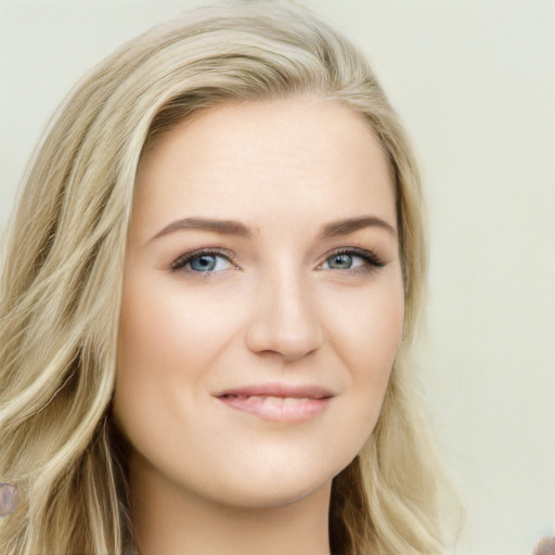 Joyful white young-adult female with long  brown hair and blue eyes