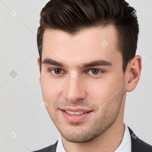 Joyful white young-adult male with short  brown hair and brown eyes