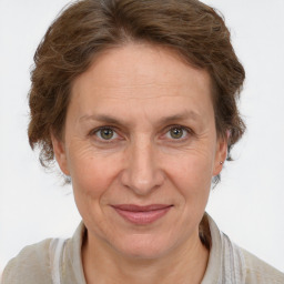 Joyful white adult female with short  brown hair and brown eyes