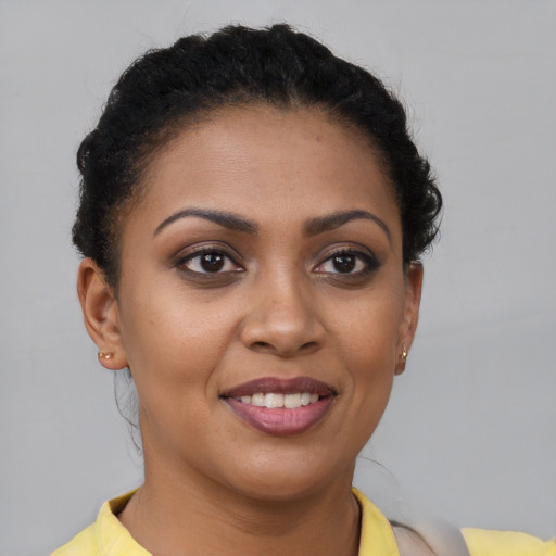 Joyful latino young-adult female with short  brown hair and brown eyes