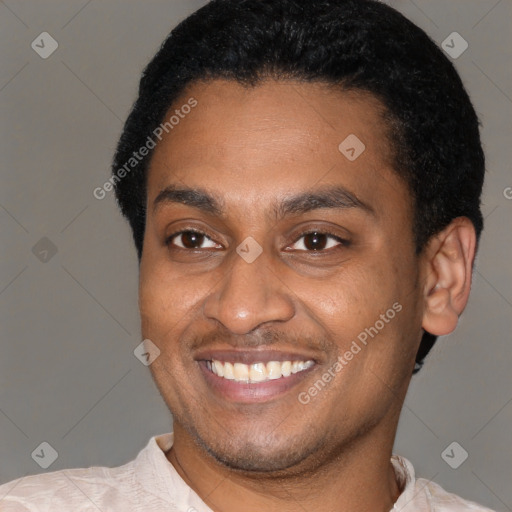 Joyful latino young-adult male with short  black hair and brown eyes