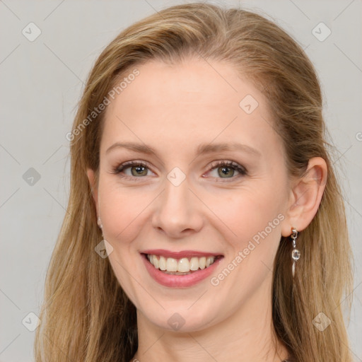 Joyful white young-adult female with long  brown hair and blue eyes