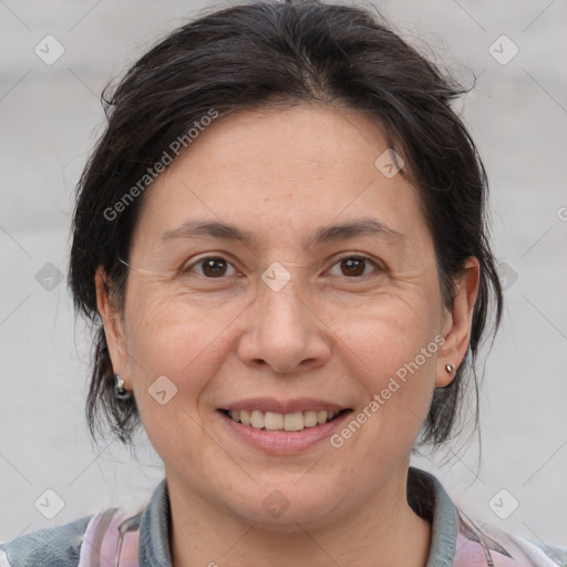 Joyful white adult female with medium  brown hair and brown eyes