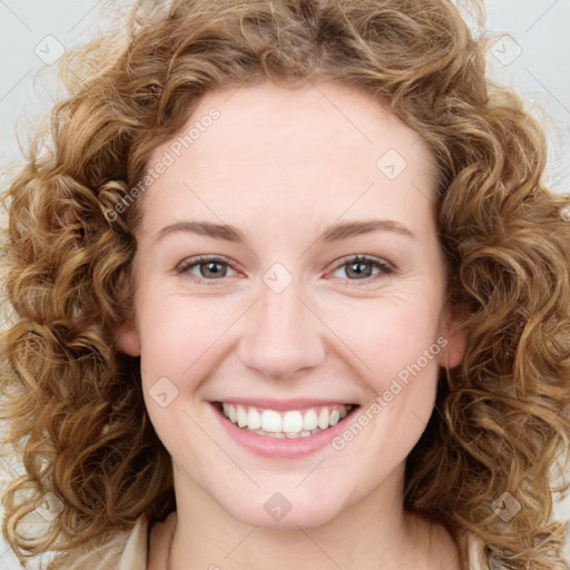 Joyful white young-adult female with long  brown hair and green eyes