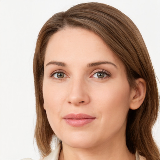 Joyful white young-adult female with medium  brown hair and green eyes