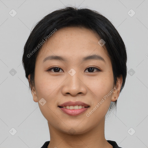 Joyful asian young-adult female with short  black hair and brown eyes