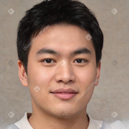 Joyful asian young-adult male with short  brown hair and brown eyes