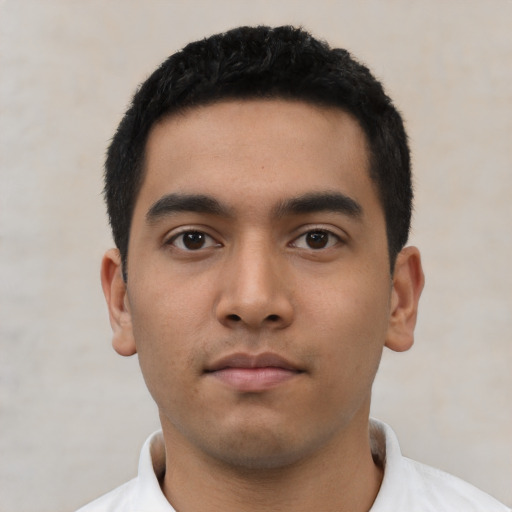 Neutral latino young-adult male with short  black hair and brown eyes