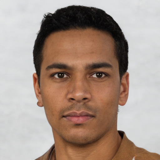 Neutral black young-adult male with short  black hair and brown eyes