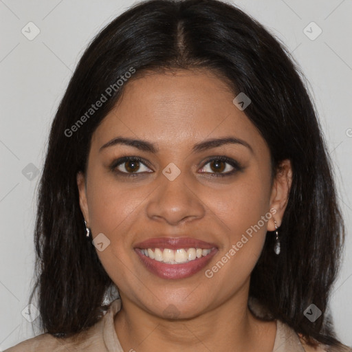 Joyful black young-adult female with medium  brown hair and brown eyes