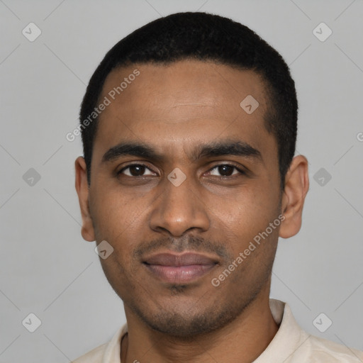 Joyful black young-adult male with short  black hair and brown eyes
