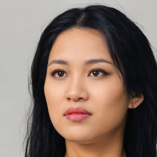 Neutral latino young-adult female with long  black hair and brown eyes