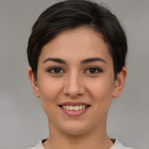 Joyful white young-adult female with short  brown hair and brown eyes