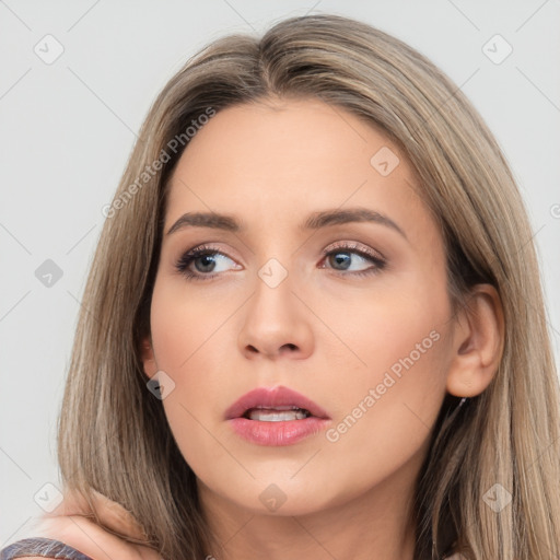 Neutral white young-adult female with long  brown hair and brown eyes