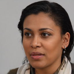 Joyful latino young-adult female with medium  black hair and brown eyes