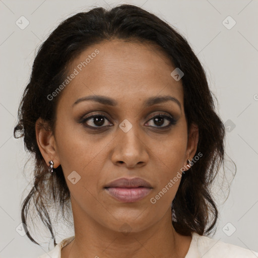 Joyful black adult female with medium  brown hair and brown eyes