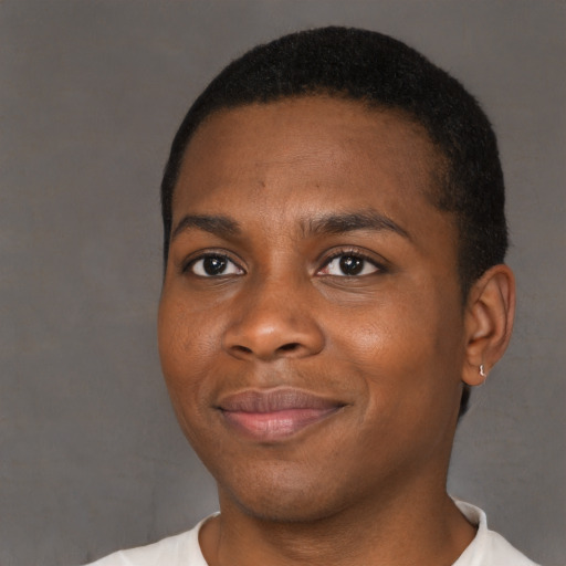 Joyful black young-adult male with short  black hair and brown eyes