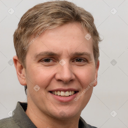 Joyful white adult male with short  brown hair and grey eyes