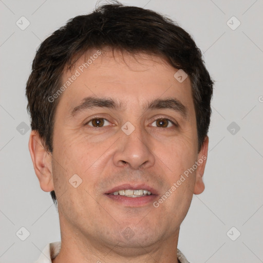 Joyful white adult male with short  brown hair and brown eyes