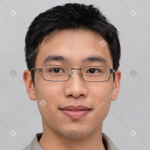 Joyful asian young-adult male with short  brown hair and brown eyes