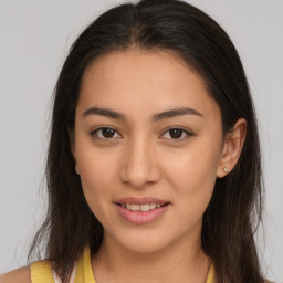 Joyful white young-adult female with long  brown hair and brown eyes