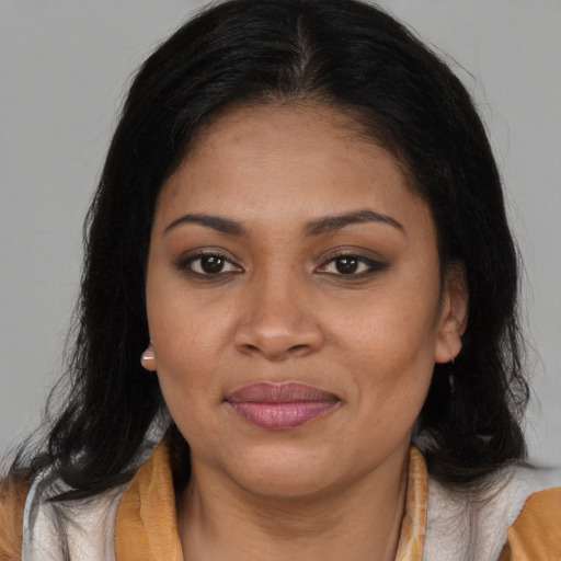 Joyful asian young-adult female with long  brown hair and brown eyes