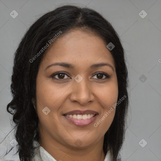 Joyful black young-adult female with long  brown hair and brown eyes