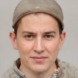 Joyful white adult male with short  brown hair and grey eyes