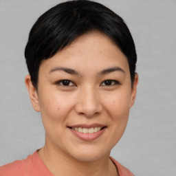 Joyful asian young-adult female with short  brown hair and brown eyes