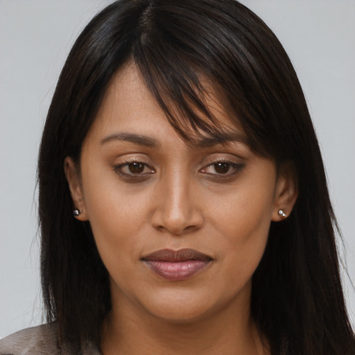Joyful asian young-adult female with long  brown hair and brown eyes