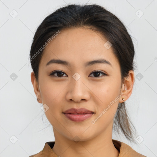 Joyful asian young-adult female with medium  brown hair and brown eyes