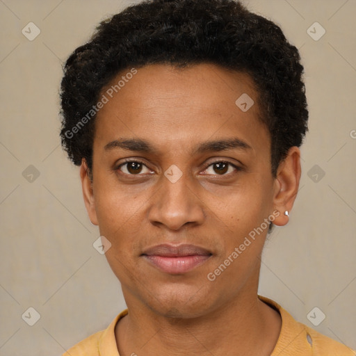 Joyful black young-adult male with short  brown hair and brown eyes