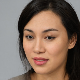 Joyful asian young-adult female with long  brown hair and brown eyes