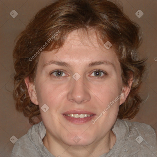 Joyful white adult female with medium  brown hair and blue eyes