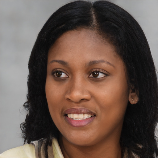 Joyful latino young-adult female with long  black hair and brown eyes
