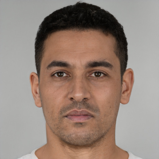 Neutral white young-adult male with short  black hair and brown eyes