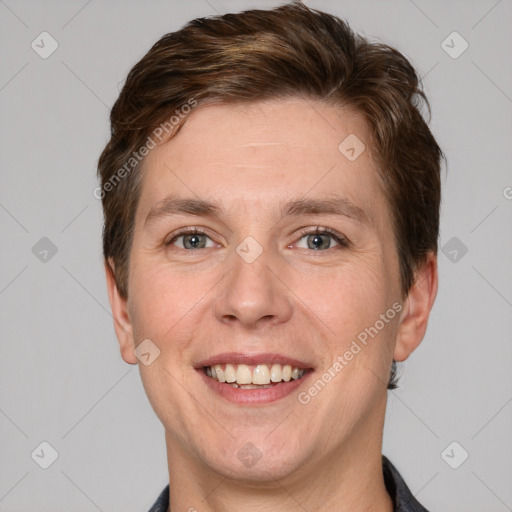 Joyful white adult male with short  brown hair and grey eyes