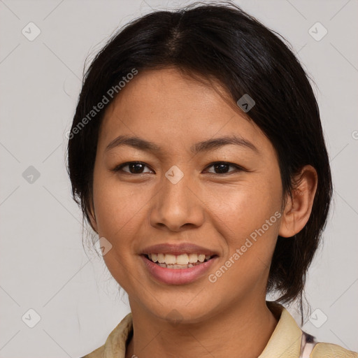 Joyful latino young-adult female with medium  brown hair and brown eyes