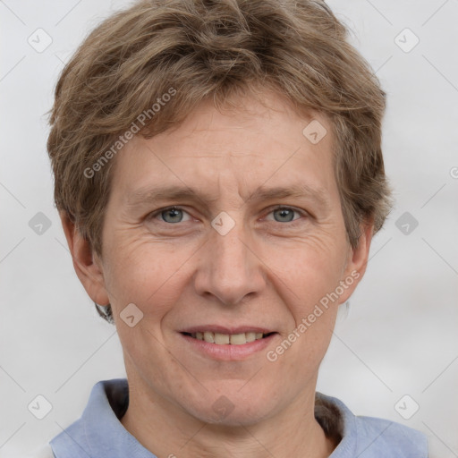 Joyful white adult male with short  brown hair and grey eyes