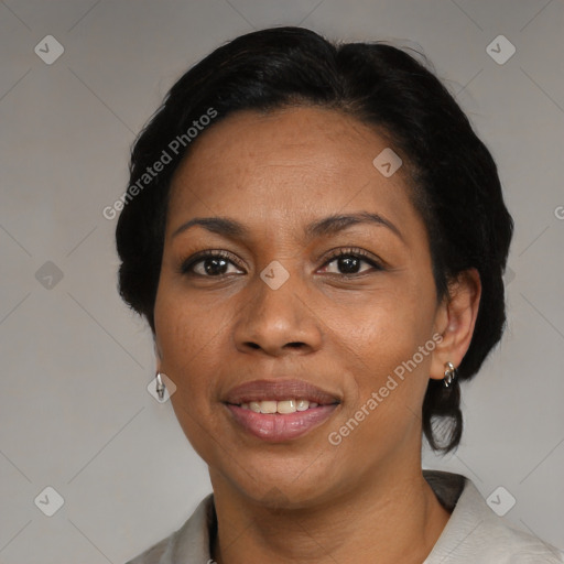 Joyful black adult female with medium  black hair and brown eyes