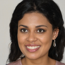 Joyful black young-adult female with medium  brown hair and brown eyes