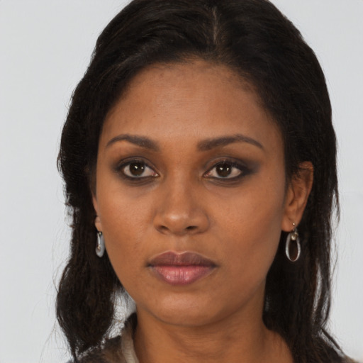 Neutral black young-adult female with long  brown hair and brown eyes