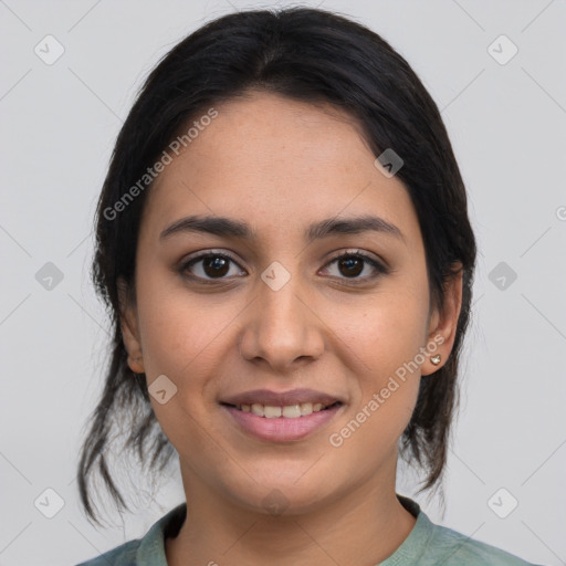 Joyful latino young-adult female with medium  brown hair and brown eyes