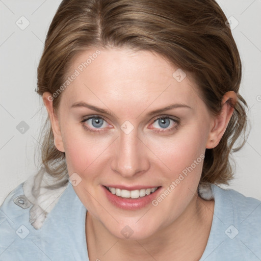 Joyful white young-adult female with medium  brown hair and blue eyes