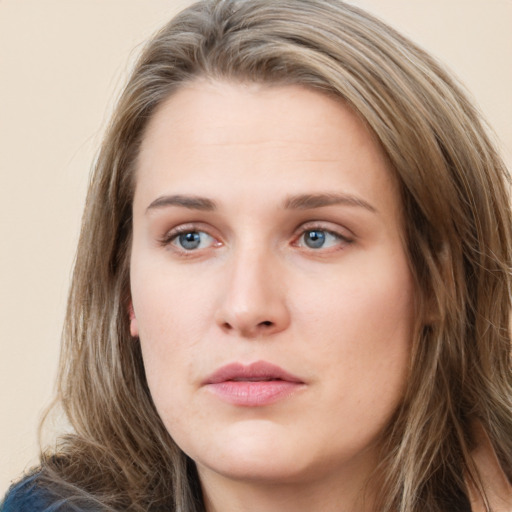 Neutral white young-adult female with long  brown hair and green eyes