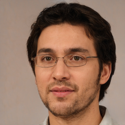 Joyful white adult male with short  brown hair and brown eyes